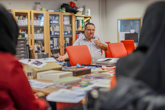 Archivist Paul Dudman discussing materials at the UEL archive