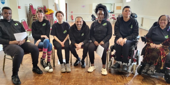 Seated group of people from Act Up Newham