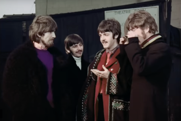 The Beatles in front of a sign for Theatre Royal in the Penny Lane music video, 1963.