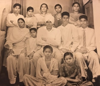 Partap with parents and siblings in India