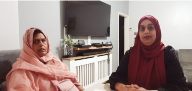 Two women sitting together