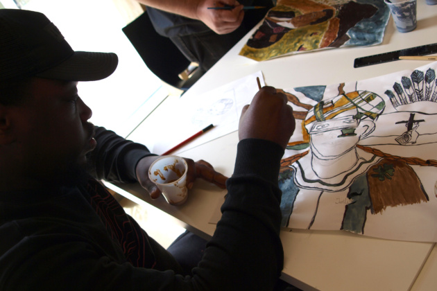 A close-up of the student's painting progress